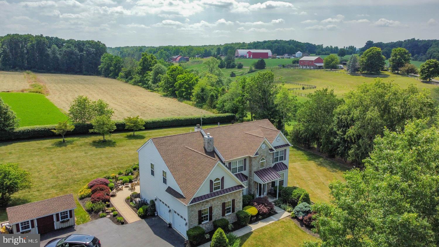 1026 Creamery Road Perkasie, PA 18944 - Photo 7 of 45 an aerial view of a house with garden space and lake view