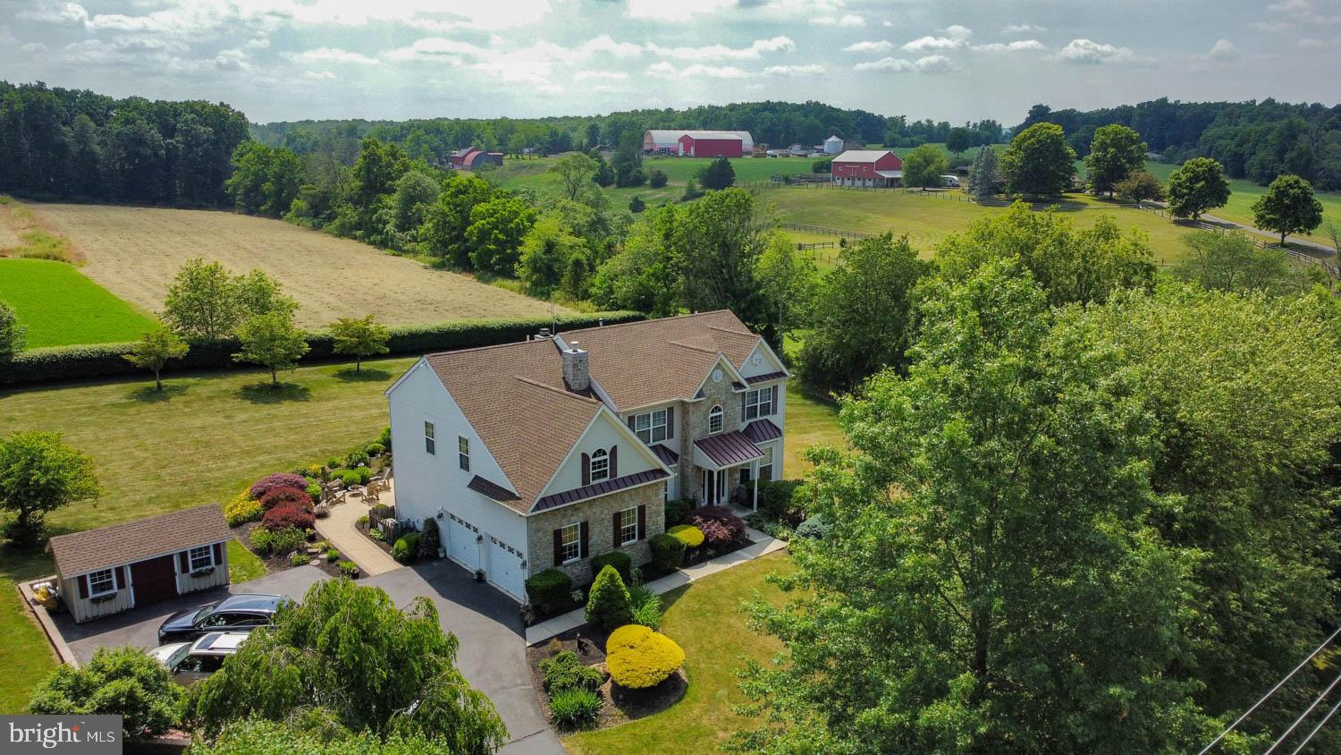 1026 Creamery Road Perkasie, PA 18944 - Photo 8 of 45 an aerial view of a house with garden space and outdoor seating