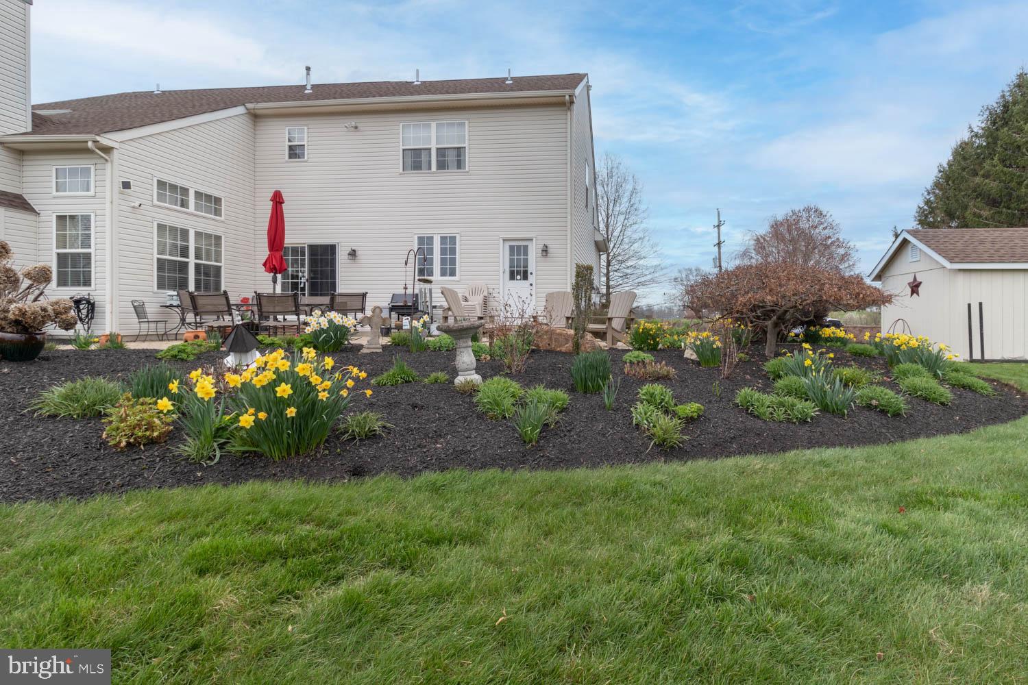 1026 Creamery Road Perkasie, PA 18944 - Photo 10 of 45 a front view of a house with a garden