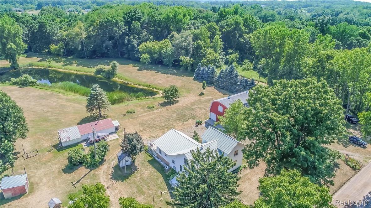 9675 Roberts Road Gregory, MI 48137 - Photo 27 of 33 Aerial photo of all structures and pond.
