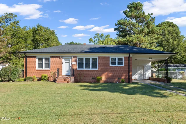 front view of a house with a yard
