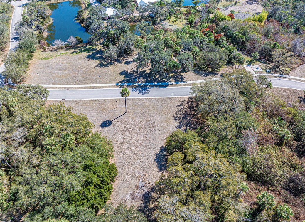 11311 Ganesh Way Sebastian, FL 32958 - Photo 25 of 28 an aerial view of a house with a yard and mountain view in back