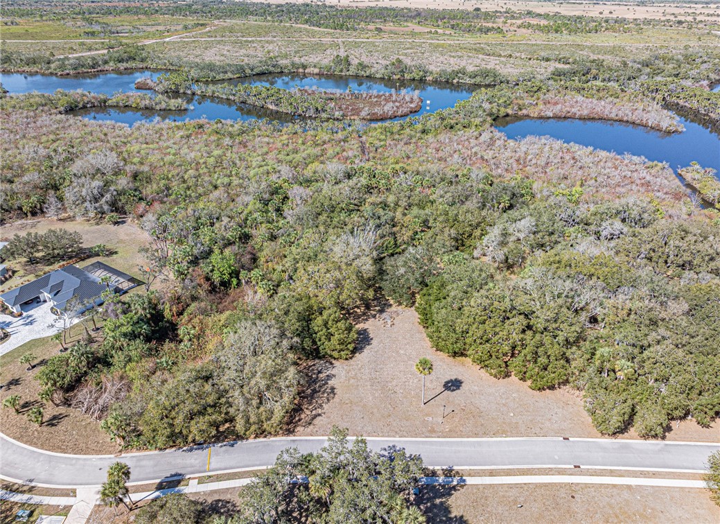 11311 Ganesh Way Sebastian, FL 32958 - Photo 8 of 28 a view of beach and small yard