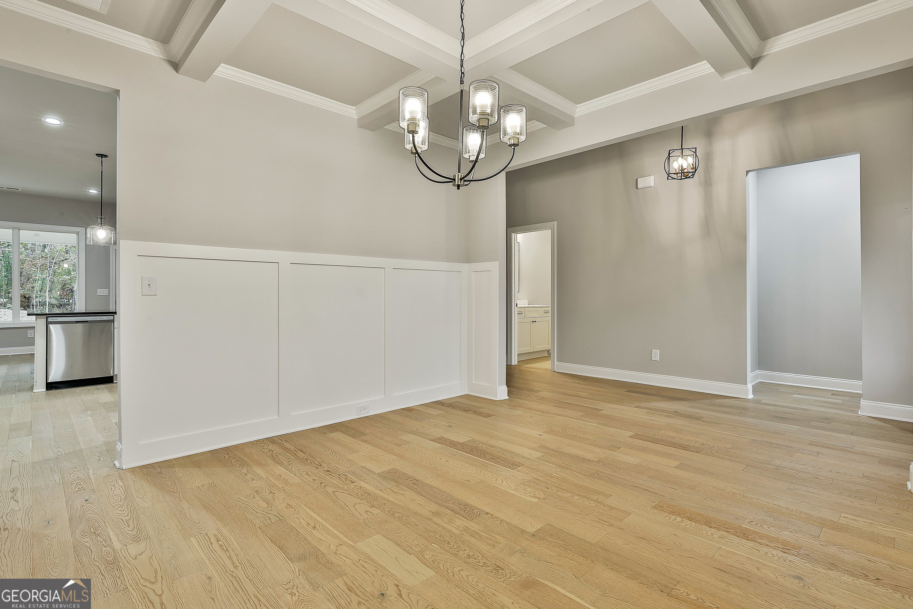 152 Wet Wood Drive, Unit 10 Fairburn, GA 30213 - Photo 11 of 39 an empty room with wooden floor mirror and windows
