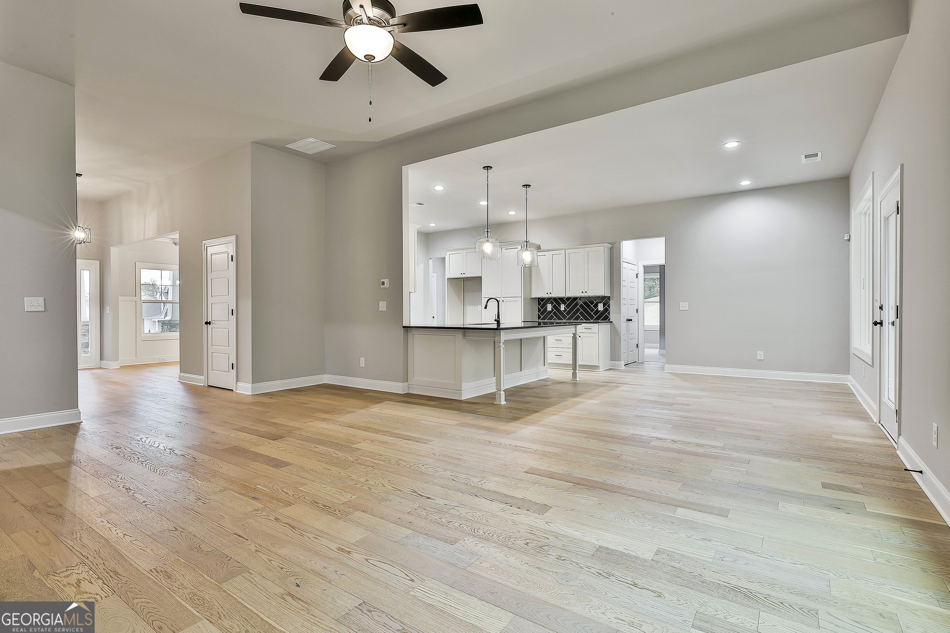 152 Wet Wood Drive, Unit 10 Fairburn, GA 30213 - Photo 17 of 39 a view of a kitchen with a sink and a window