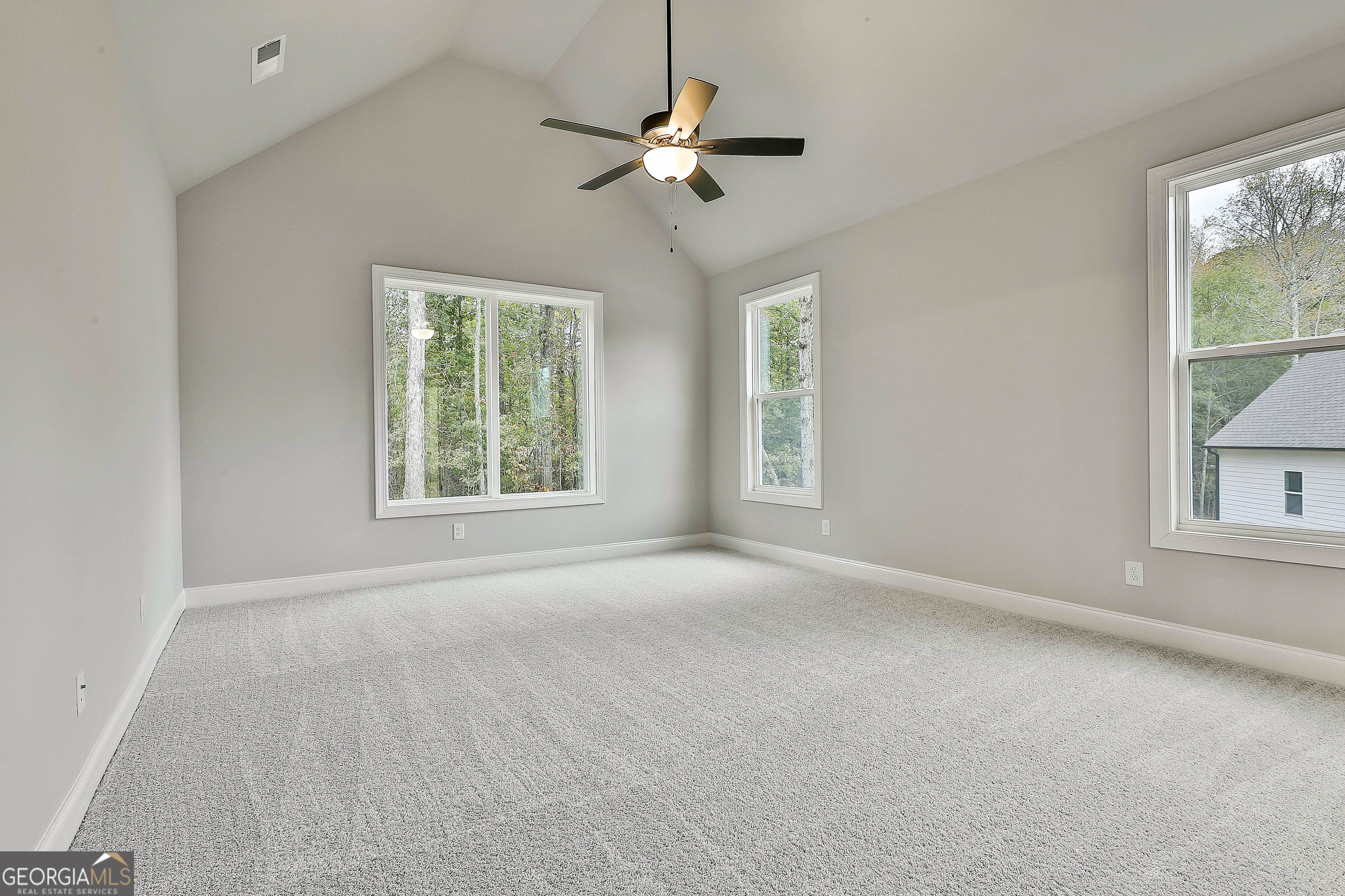 152 Wet Wood Drive, Unit 10 Fairburn, GA 30213 - Photo 27 of 39 a view of an empty room with a window