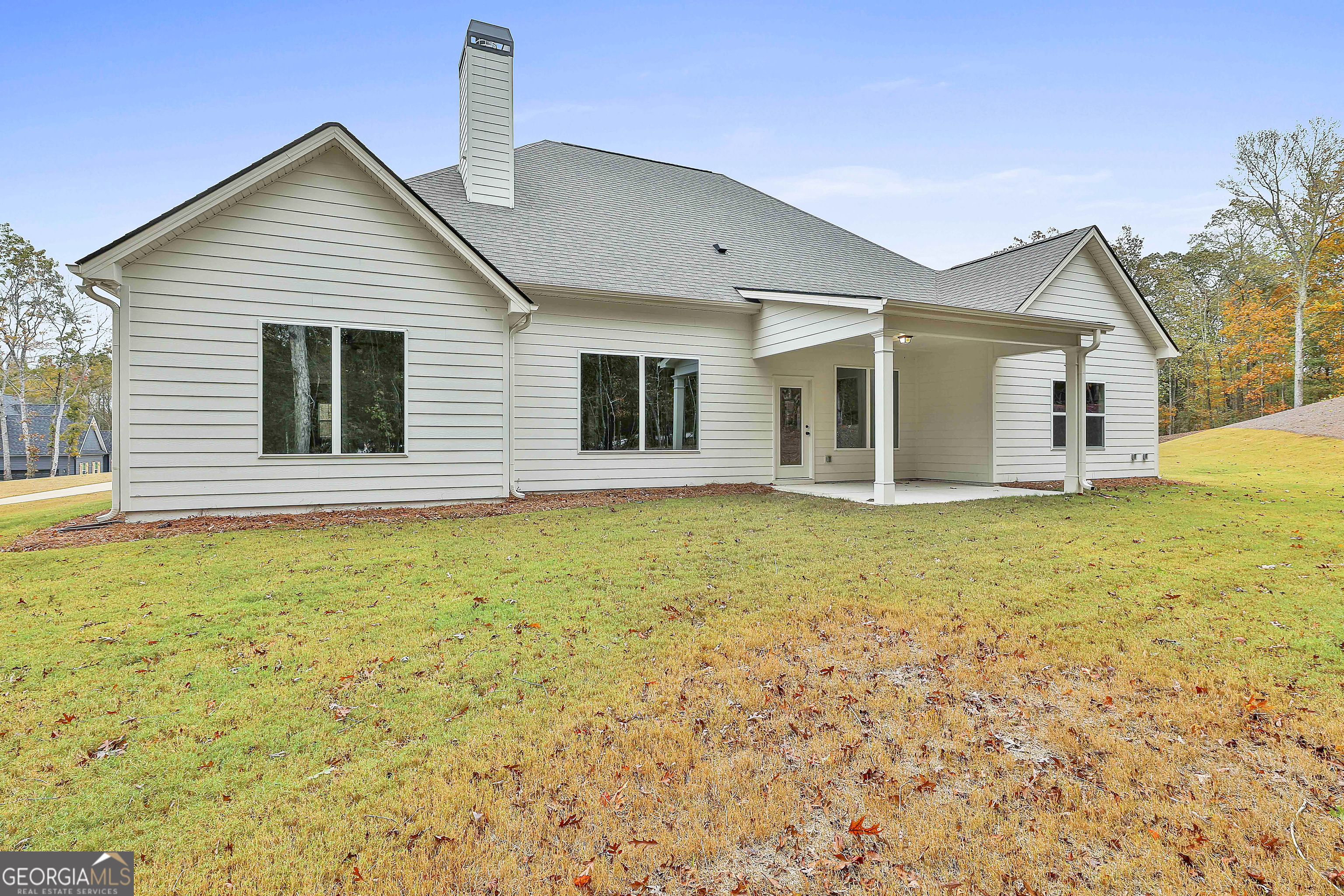 152 Wet Wood Drive, Unit 10 Fairburn, GA 30213 - Photo 38 of 39 a view of a house with a swimming pool