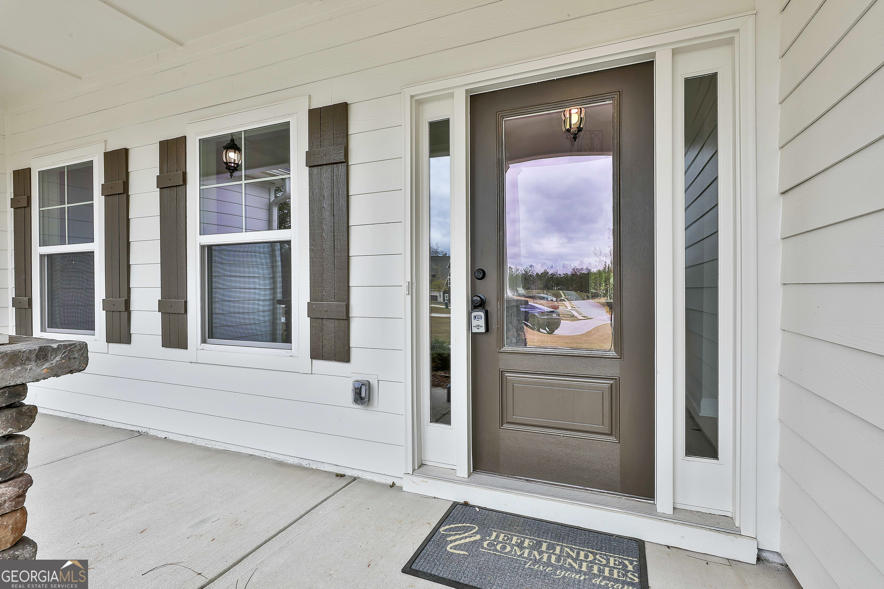 152 Wet Wood Drive, Unit 10 Fairburn, GA 30213 - Photo 6 of 39 a view of front door of house with a outdoor space