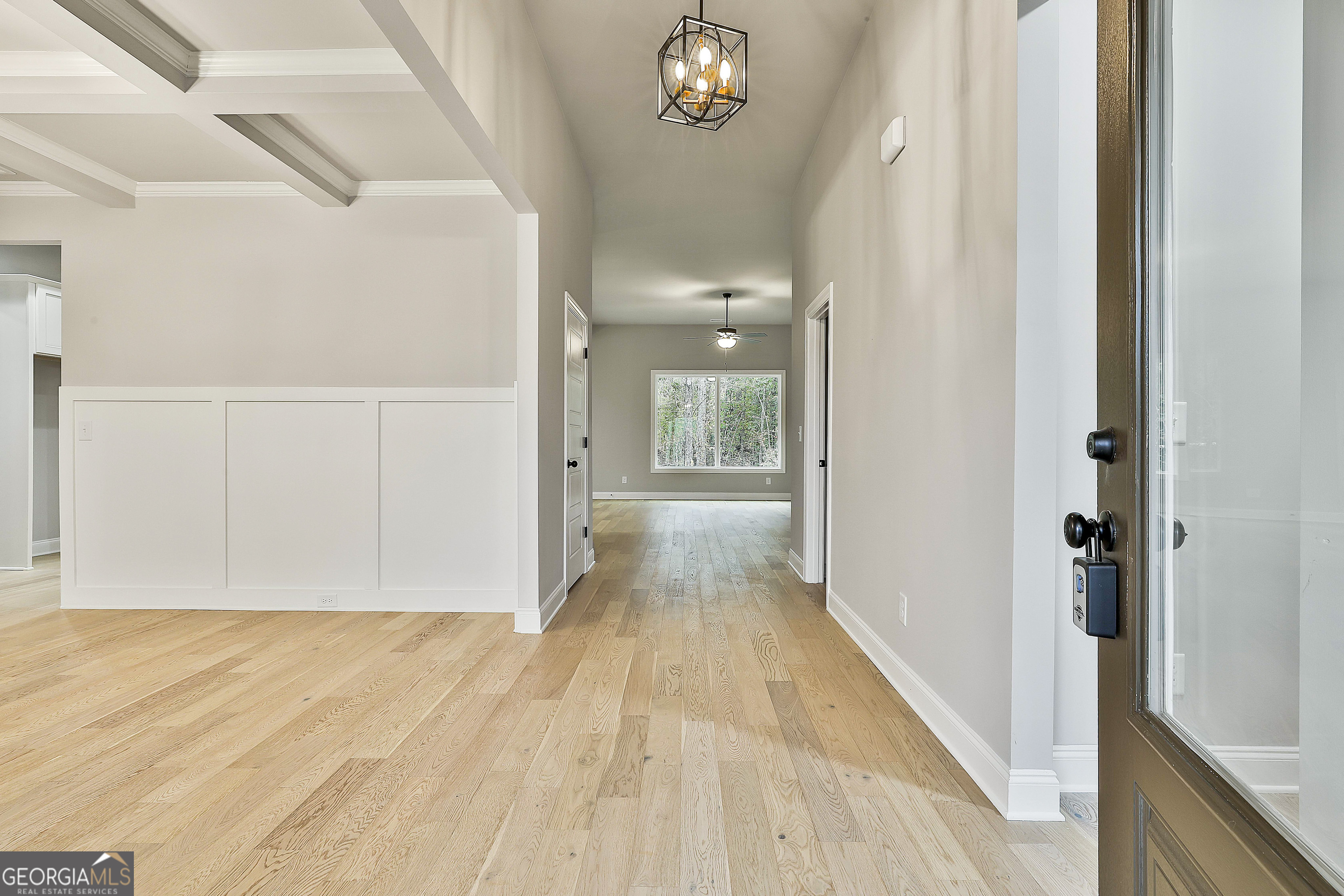 152 Wet Wood Drive, Unit 10 Fairburn, GA 30213 - Photo 7 of 39 a view of a hallway with wooden floor