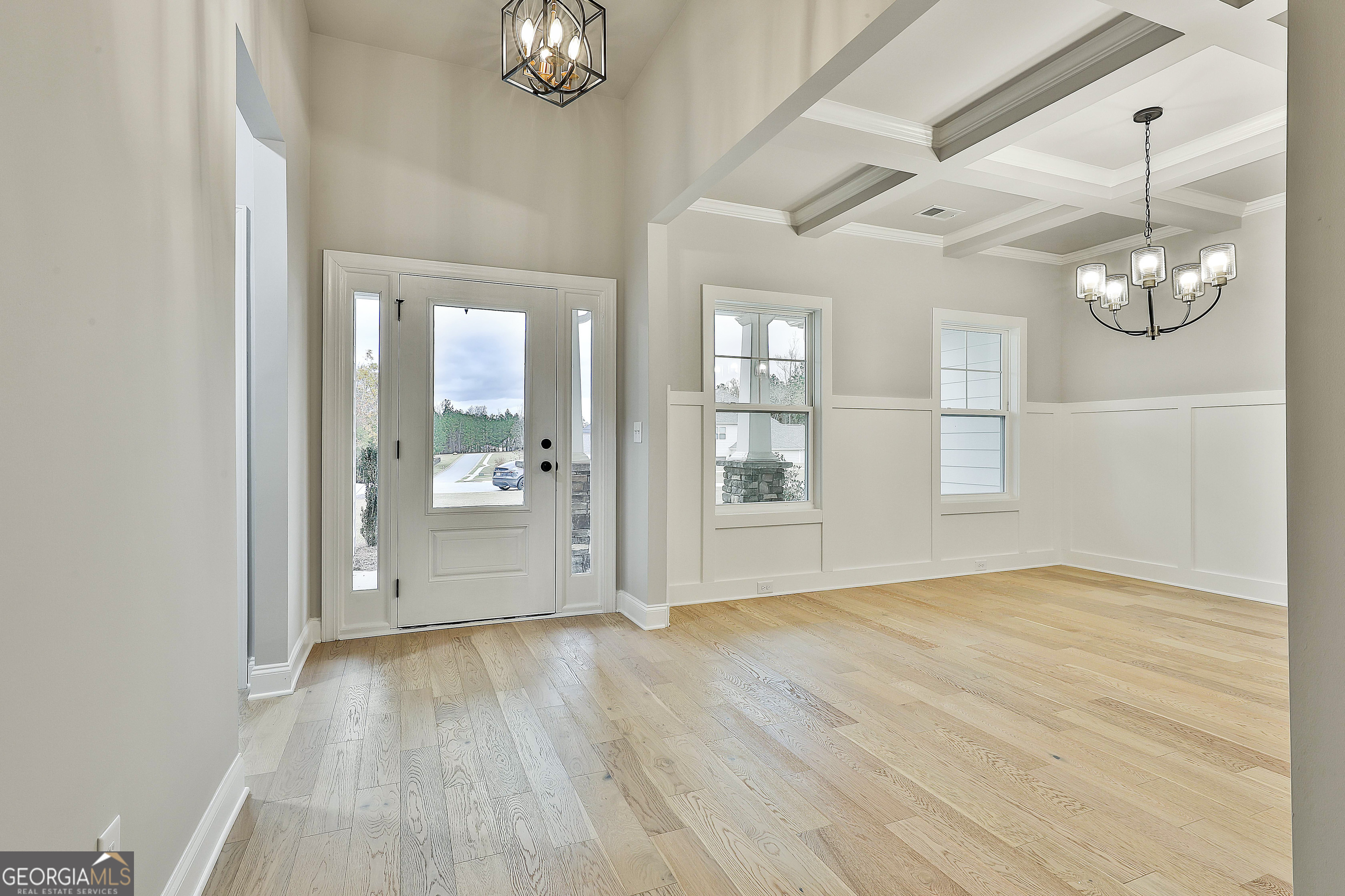 152 Wet Wood Drive, Unit 10 Fairburn, GA 30213 - Photo 8 of 39 wooden floor in an empty room with a window