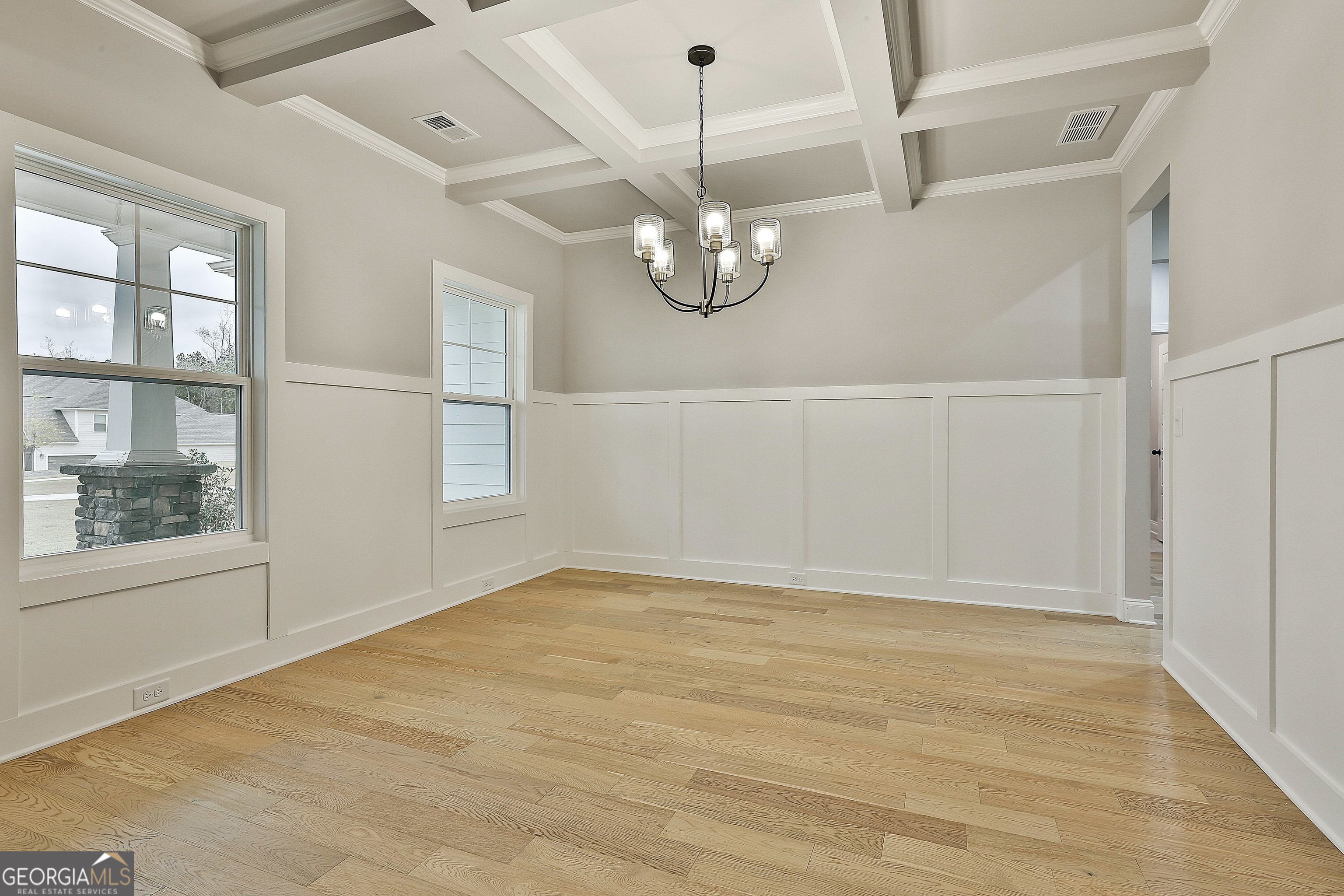 152 Wet Wood Drive, Unit 10 Fairburn, GA 30213 - Photo 9 of 39 a view of an empty room with a window