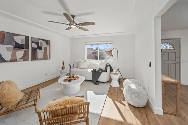 a view of a livingroom with furniture and wooden floor