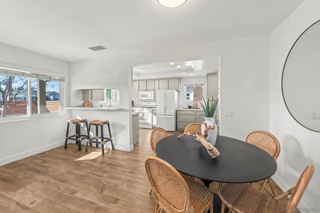 a kitchen with a refrigerator sink stove and cabinets