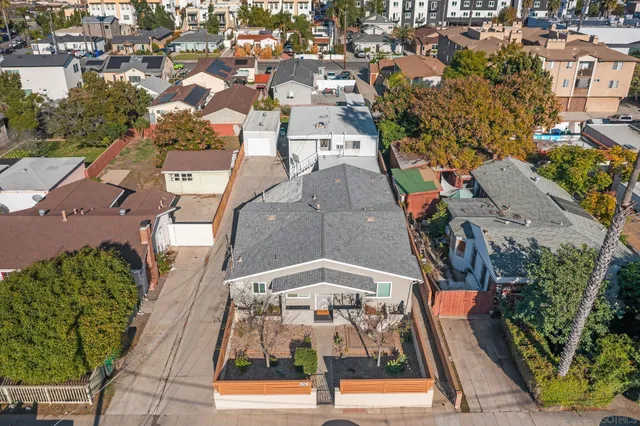 an aerial view of residential houses with outdoor space