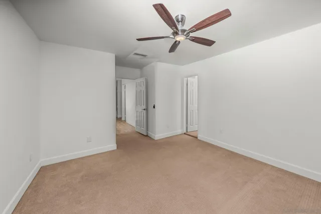 a bathroom with a shower and a sink