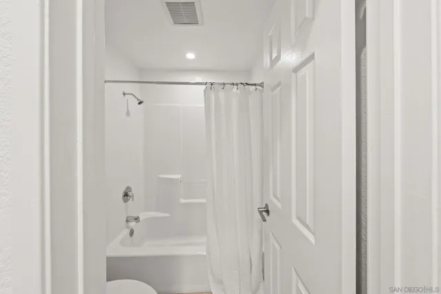 a view of a room with racks on the wall