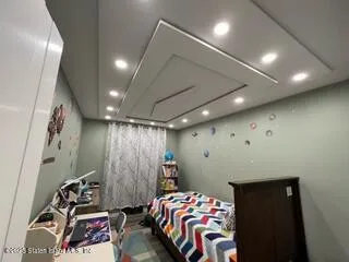 a bedroom with a bed and a walk in closet