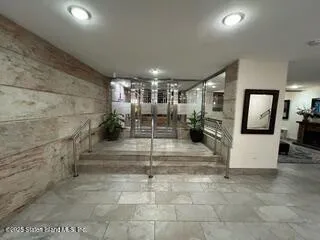 a view of entryway wih livingroom and stairs
