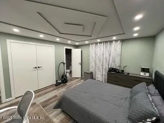 a bed room with a bed and furniture