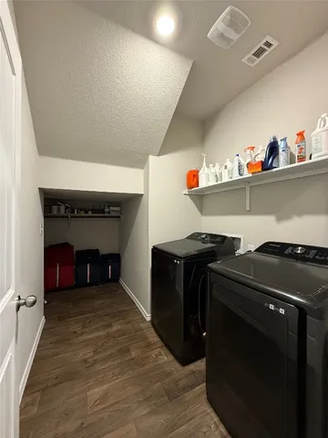 a kitchen with a refrigerator and a stove