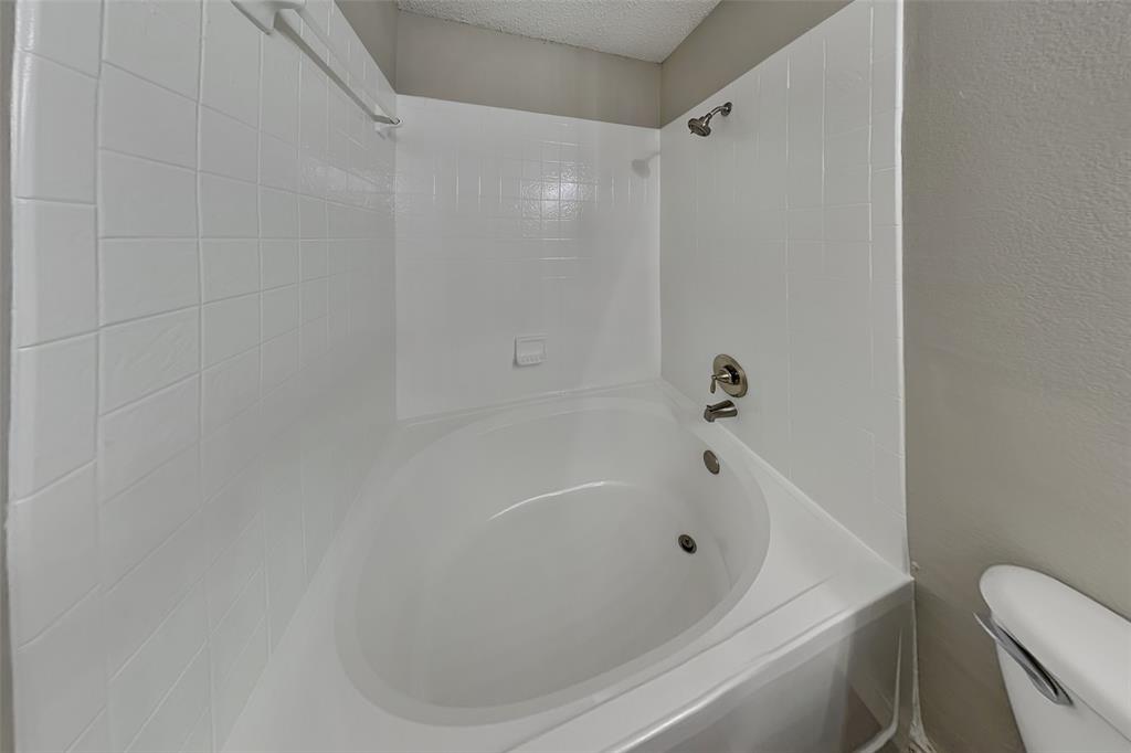 4224 Birch Creek Road Fort Worth, TX 76244 - Photo 11 of 19 a bathroom with a bathtub