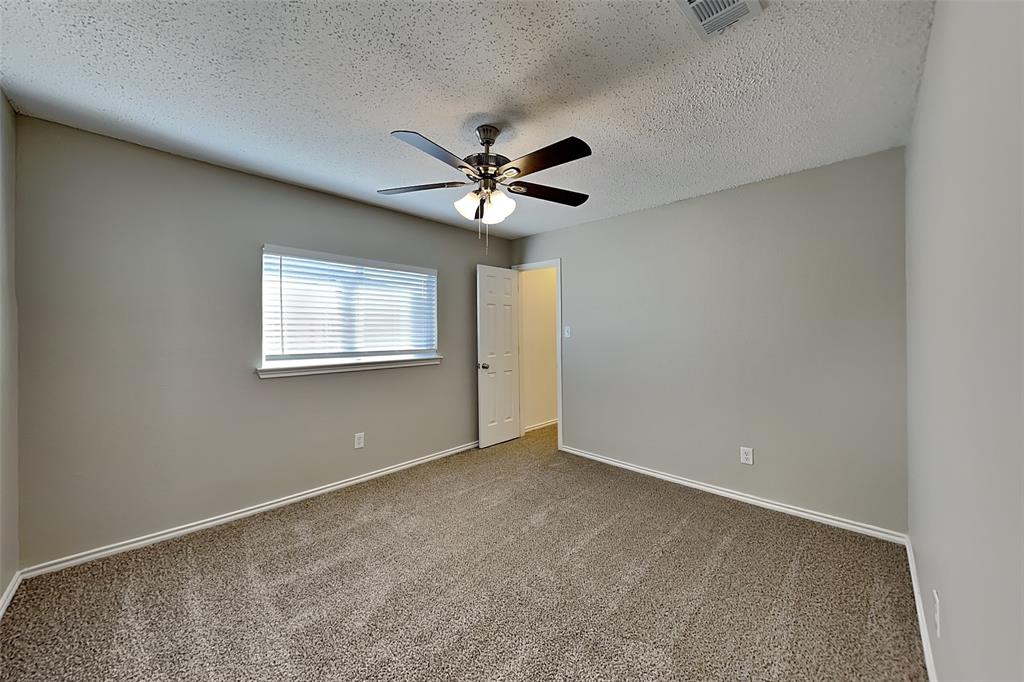 4224 Birch Creek Road Fort Worth, TX 76244 - Photo 12 of 19 a view of an empty room with a ceiling fan