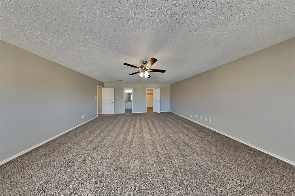 4224 Birch Creek Road Fort Worth, TX 76244 - Photo 7 of 19 a view of a livingroom with a ceiling fan and hardwood floor