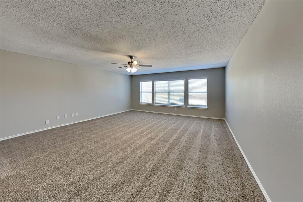 4224 Birch Creek Road Fort Worth, TX 76244 - Photo 9 of 19 wooden floor in an empty room with a window