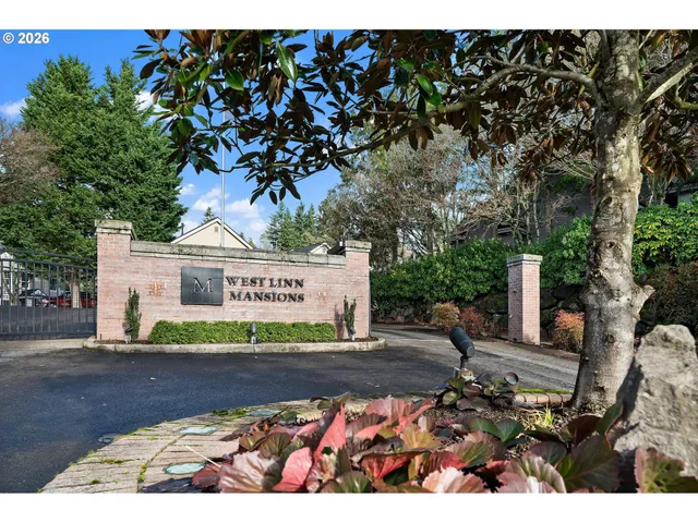 a sign that is sitting in front of a house