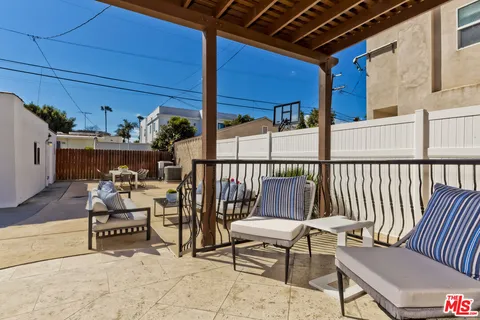 a view of a chairs and a couch in the patio
