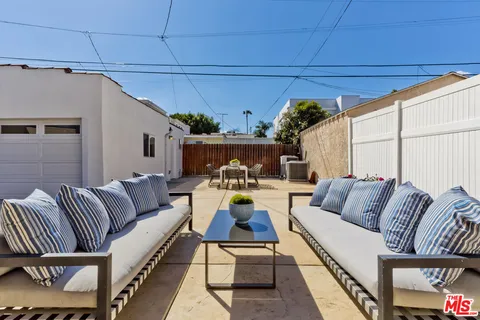 a living room with stairs and a table