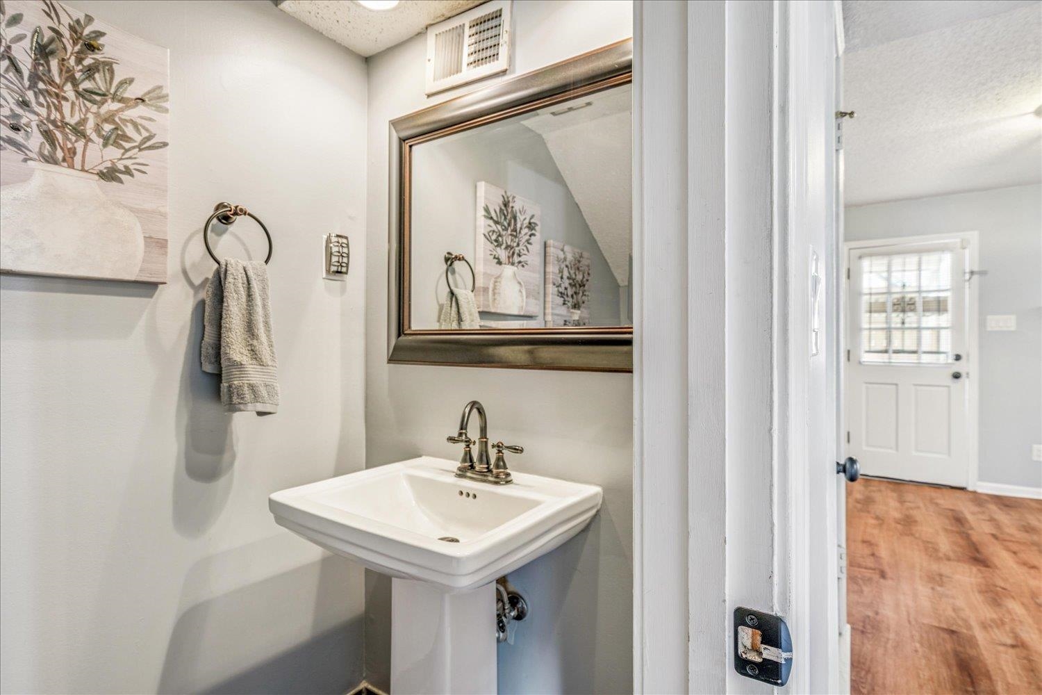 7503 Bavarian Drive, Unit 19 Germantown, TN 38138 - Photo 12 of 36 a bathroom with a sink mirror and vanity