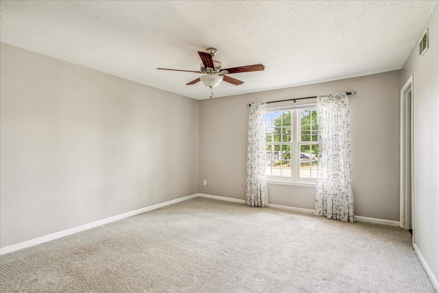 7503 Bavarian Drive, Unit 19 Germantown, TN 38138 - Photo 18 of 36 an empty room with windows and fan