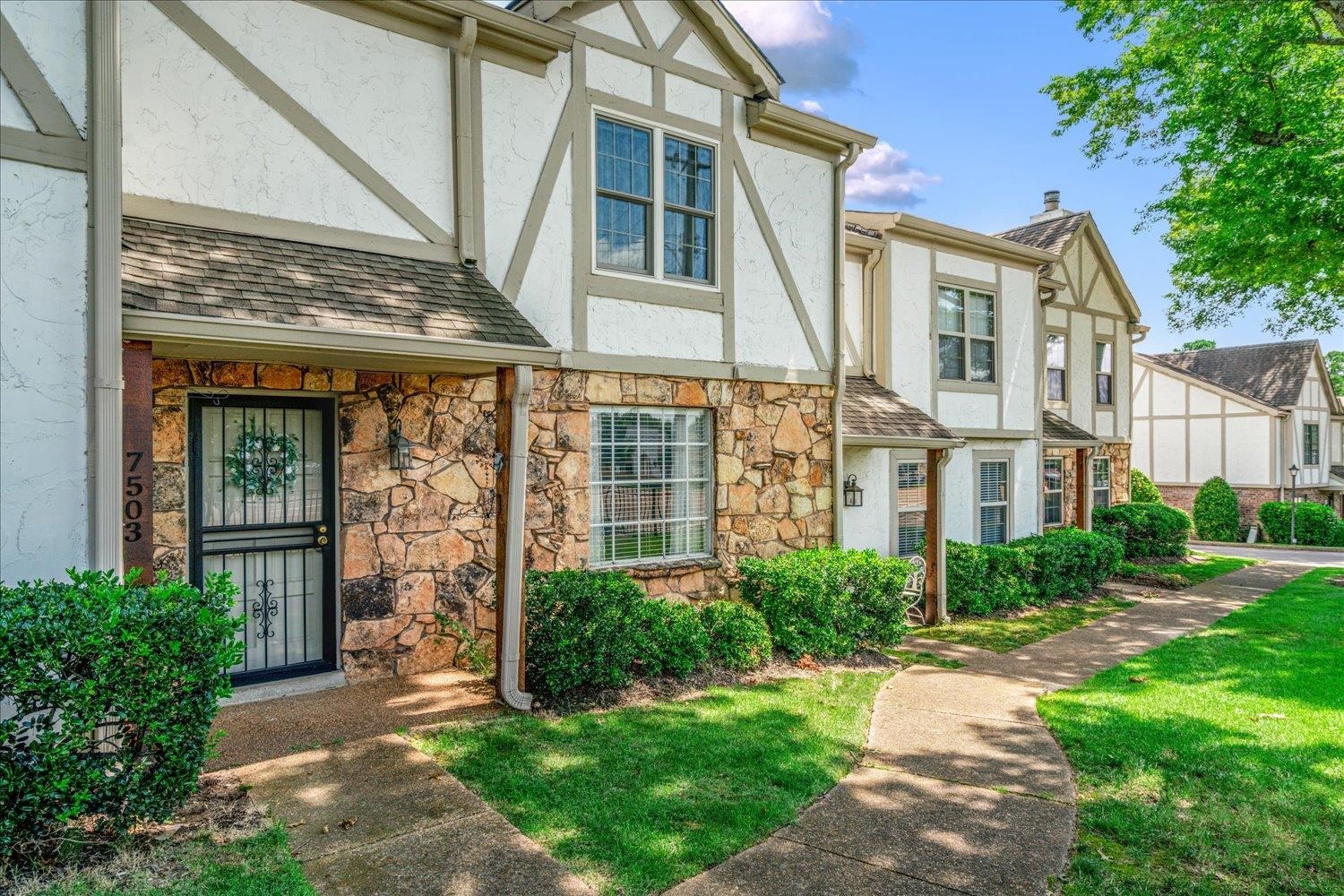 7503 Bavarian Drive, Unit 19 Germantown, TN 38138 - Photo 2 of 36 front view of a house with a yard