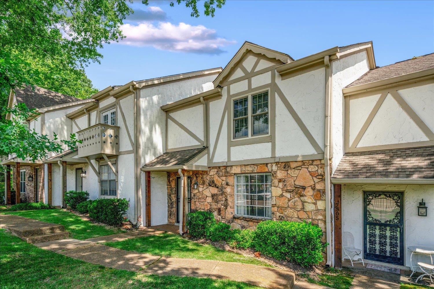 7503 Bavarian Drive, Unit 19 Germantown, TN 38138 - Photo 33 of 36 front view of a house with a yard