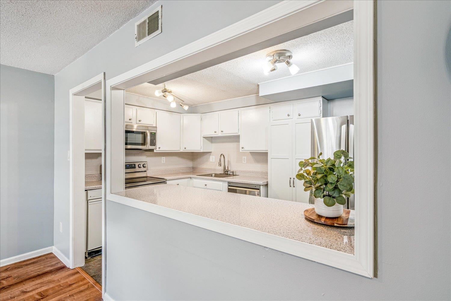 7503 Bavarian Drive, Unit 19 Germantown, TN 38138 - Photo 6 of 36 a large white kitchen with a stove and a refrigerator