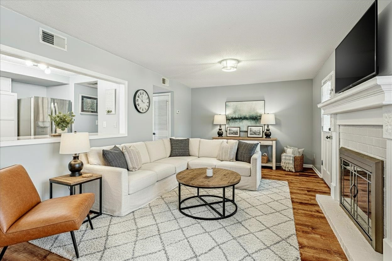 7503 Bavarian Drive, Unit 19 Germantown, TN 38138 - Photo 7 of 36 a living room with furniture and a fireplace