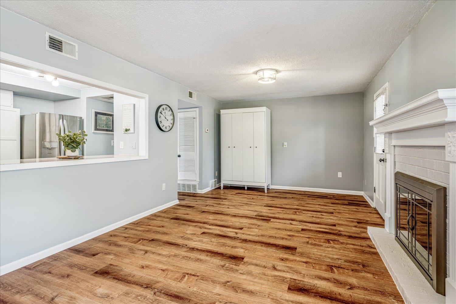 7503 Bavarian Drive, Unit 19 Germantown, TN 38138 - Photo 8 of 36 a view of empty room with window and fireplace