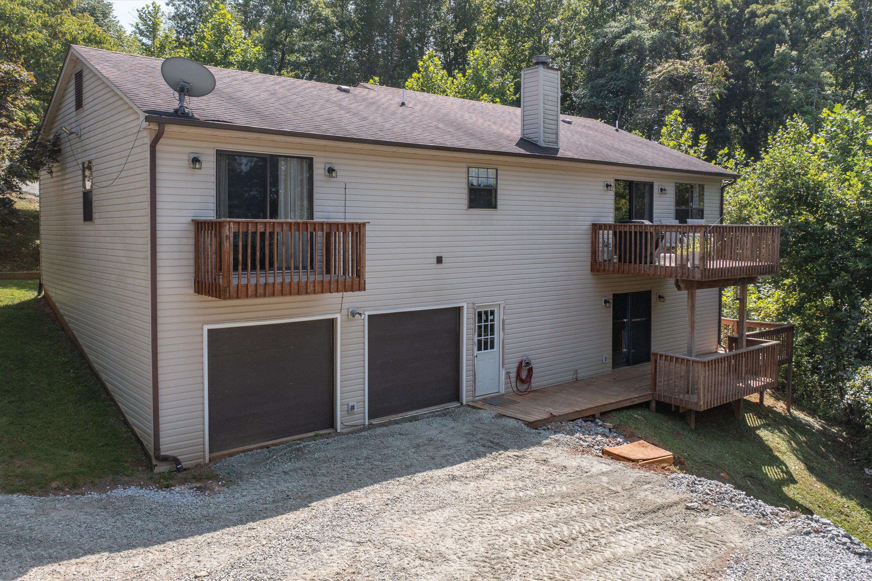 1595 Rock Spring Road Goodview, VA 24095 - Photo 40 of 50 a view of a house with a yard