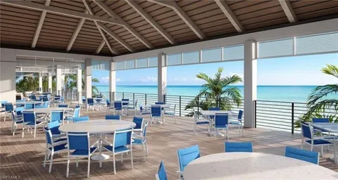 a very nice looking living room with furniture and floor to ceiling window