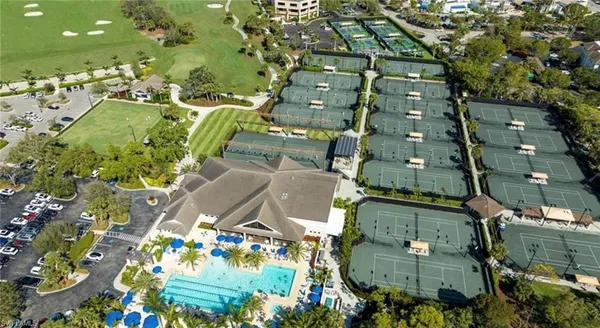 an aerial view of a residential houses with outdoor space