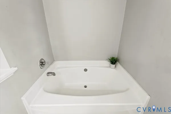 a bathroom with a toilet a sink and a large mirror