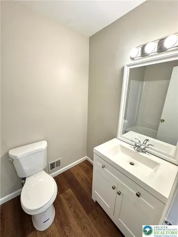a bathroom with a toilet a sink and bathtub
