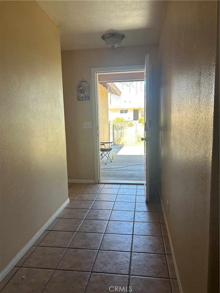 1301 West Willow Avenue Ridgecrest, CA 93555 - Photo 3 of 12 a view of an empty room and window