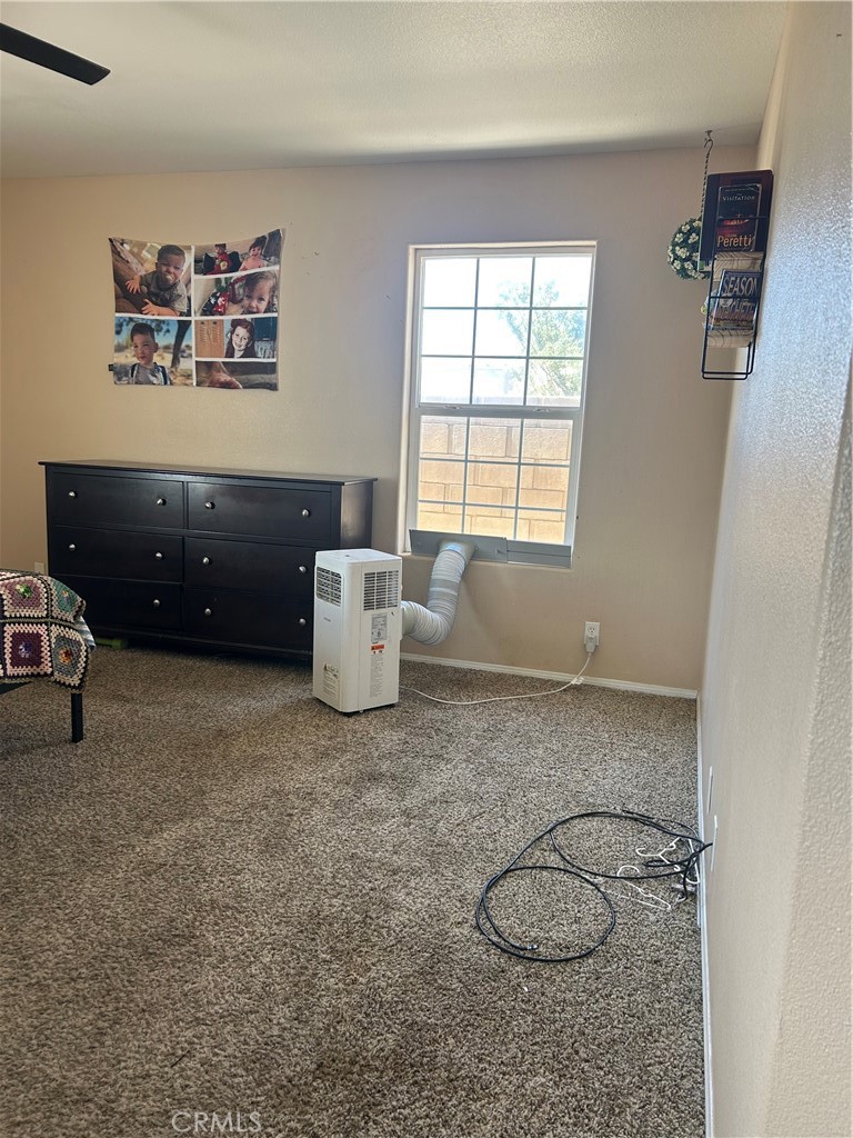 1301 West Willow Avenue Ridgecrest, CA 93555 - Photo 7 of 12 a room with a cabinets and a window