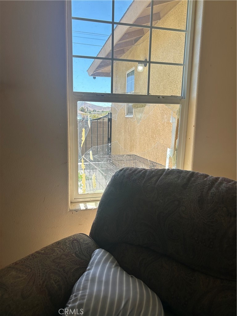1301 West Willow Avenue Ridgecrest, CA 93555 - Photo 10 of 12 a bedroom with a bed and a window