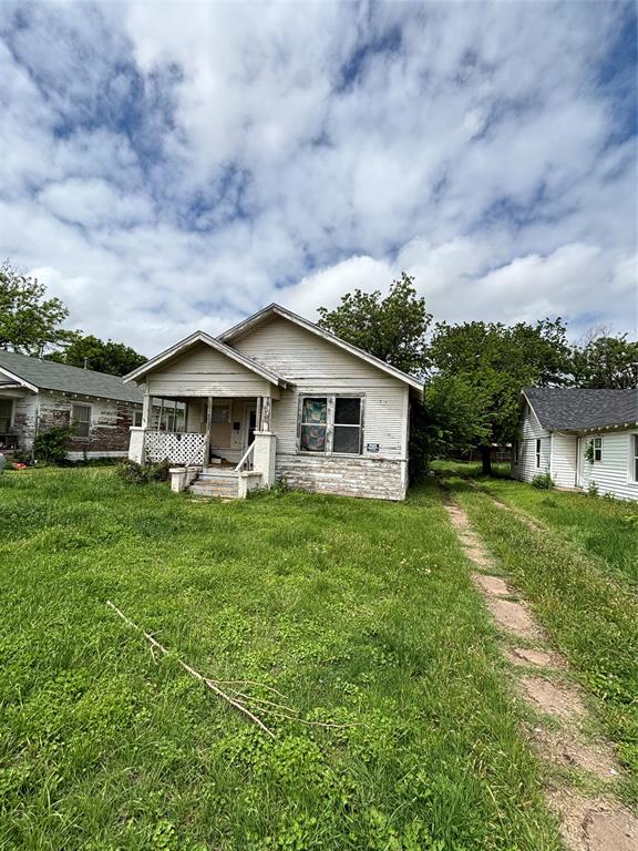 1610 Lucile Avenue Wichita Falls, TX 76301 - Photo 2 of 13 Single-story residence featuring a covered porch, wood siding exterior, and a gabled roofline