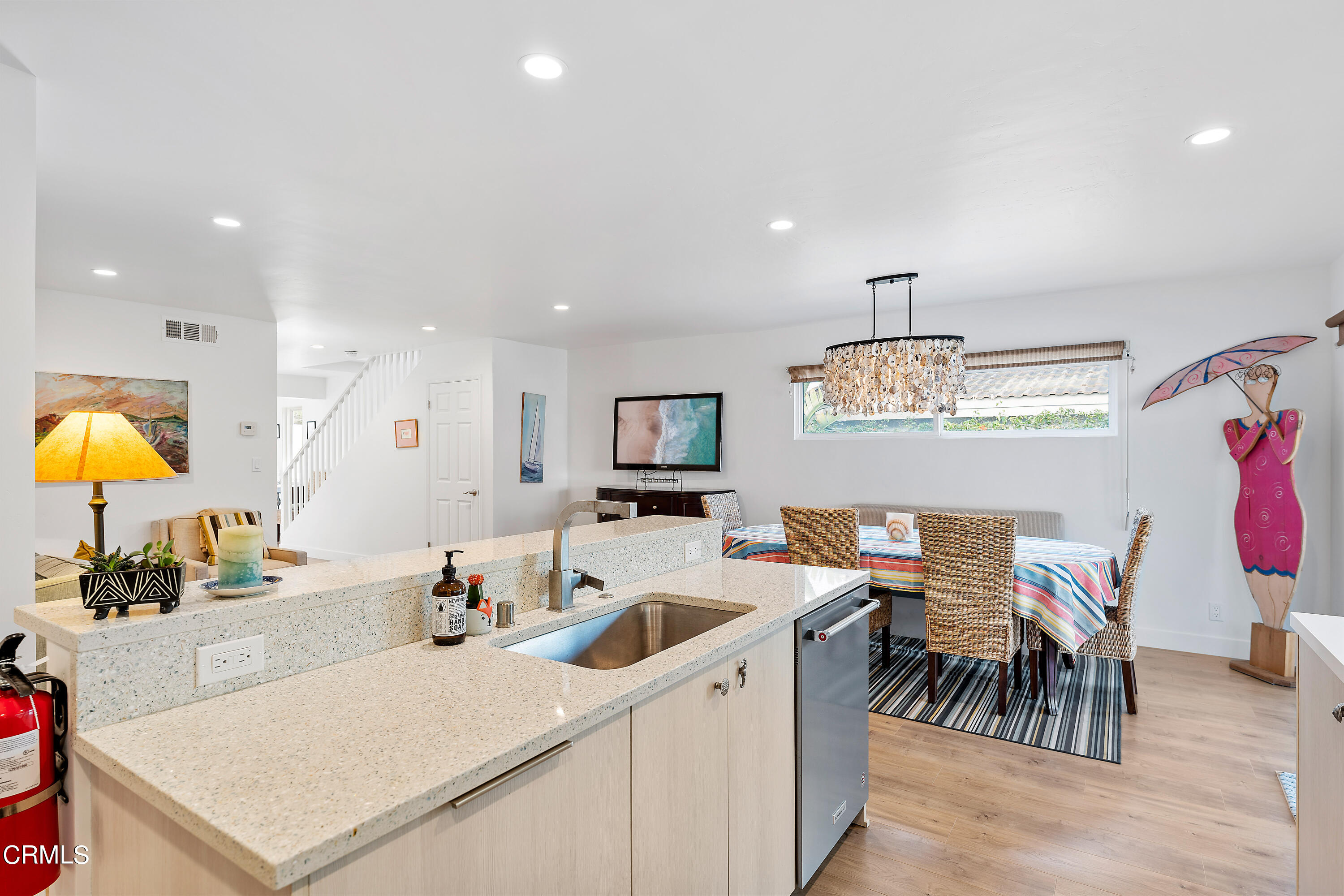 5207 Sealane Way Oxnard, CA 93035 - Photo 17 of 45 a living room with stainless steel appliances kitchen island furniture and a view of living room