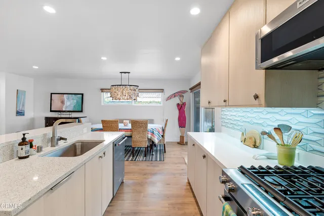 a kitchen that has a lot of cabinets in it