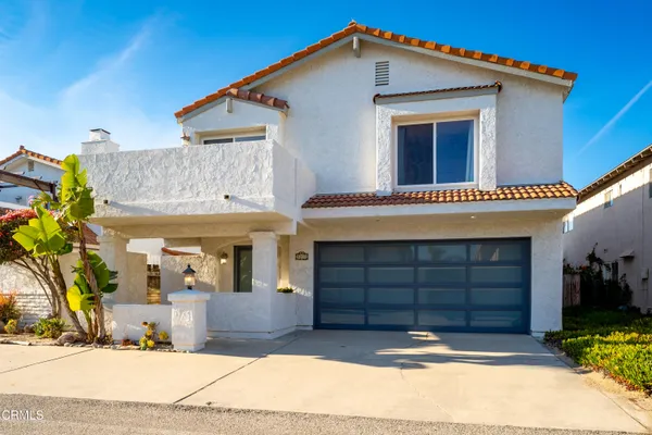 a front view of a house with a garage